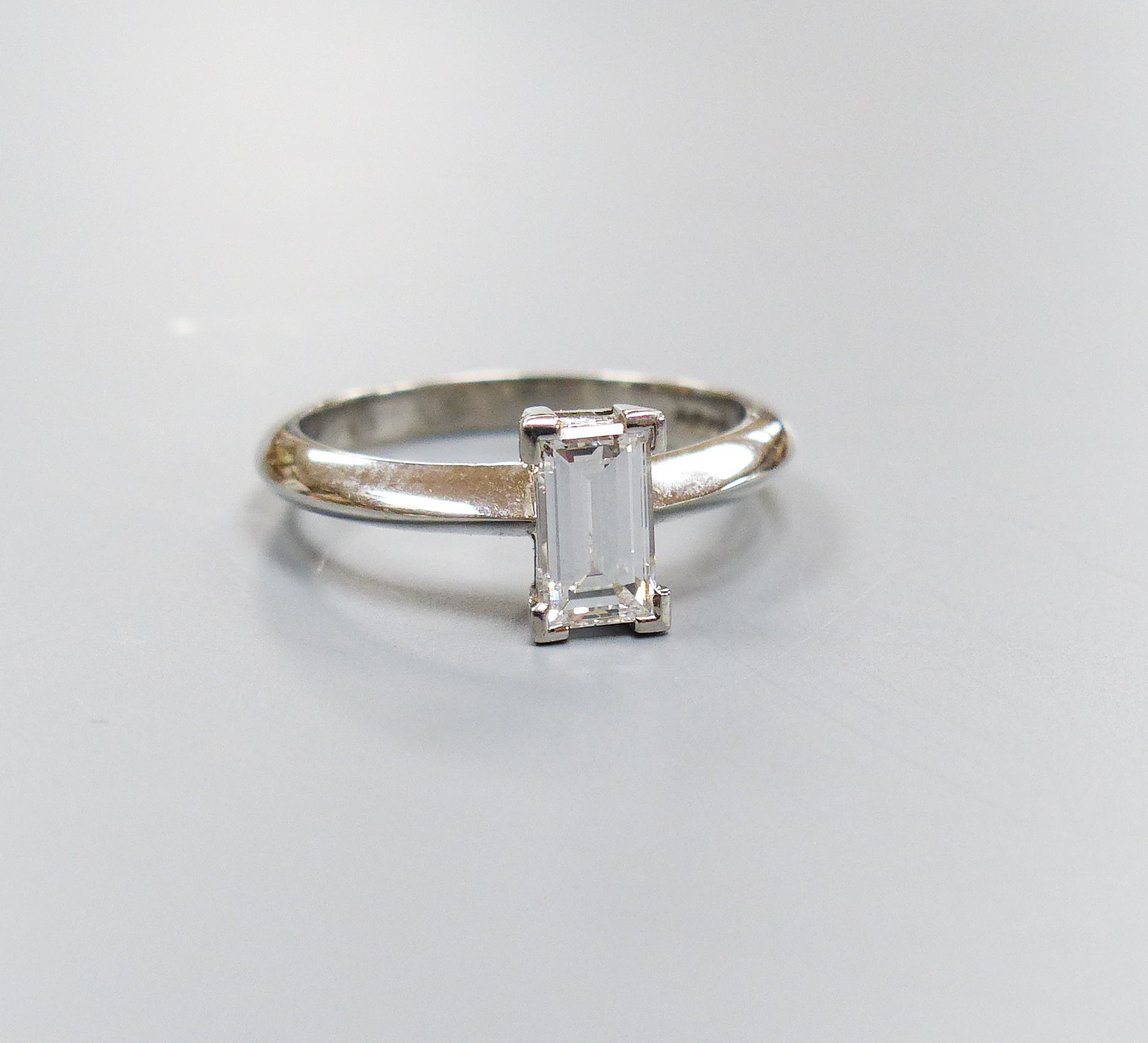 A modern platinum and solitaire rectangular cut diamond ring, size L, gross 4.5 grams